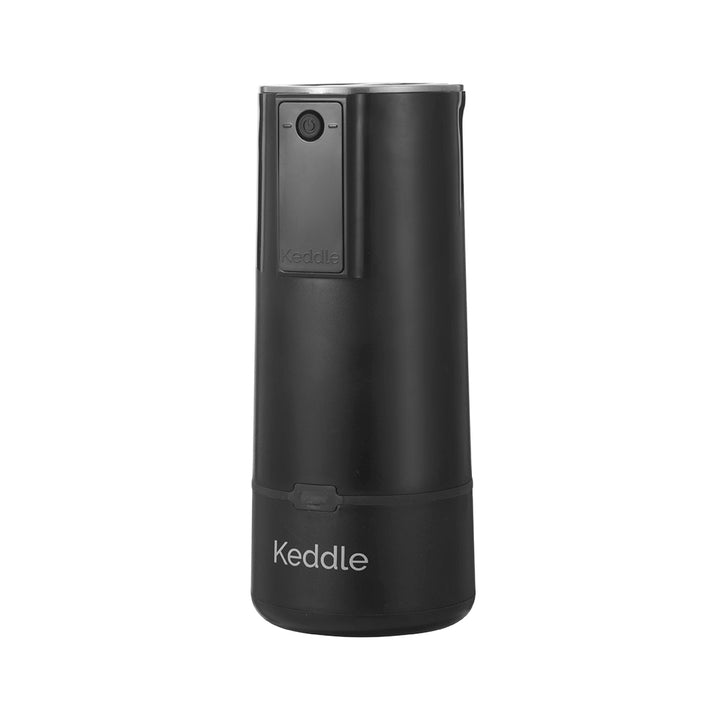 Side view of the BisbeeBaby Keddle cordless portable bottle warmer in matte black, featuring a compact, travel-ready design for warming breast milk or formula.