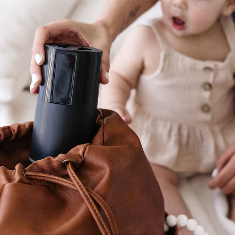 BisbeeBaby Keddle battery powered portable bottle warmer fits in baby bag making it an must have travel warmer.