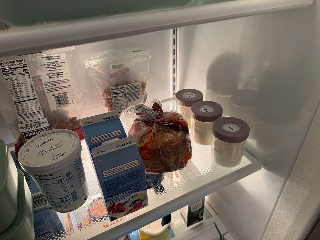 BisbeeBaby glass breast milk storage jars numbered 1 to 3 stored neatly on a refrigerator shelf, showing organized breast milk storage using smart, numbered jars.